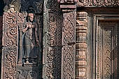 Banteay Srei temple - sculpted devata figure in niches 